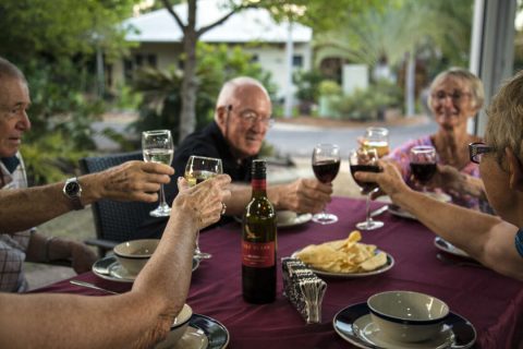 Greenfields residents enjoying dinner and drinks together