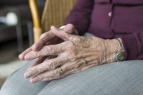 Woman's hands in lap